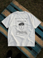 Psycho Helmet Cult – White Tee – flat-lay | Meme Tees
