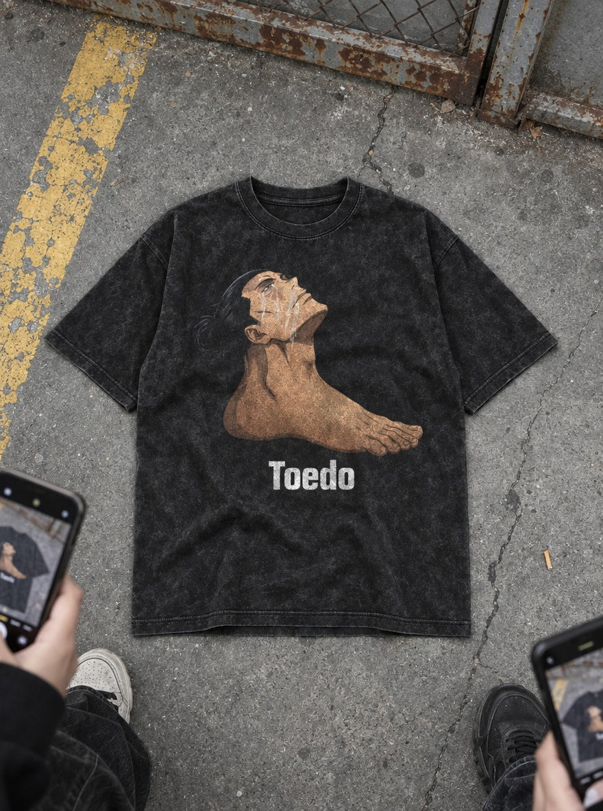 Toe Do – Black Acid Wash Tee – flat-lay | Meme Tees